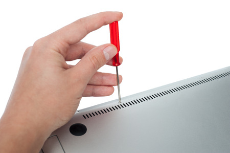 man repair laptop with screwdriverの写真素材