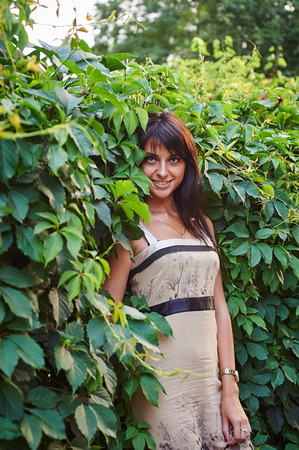 Smiling happy woman with plants. Green conceptの写真素材