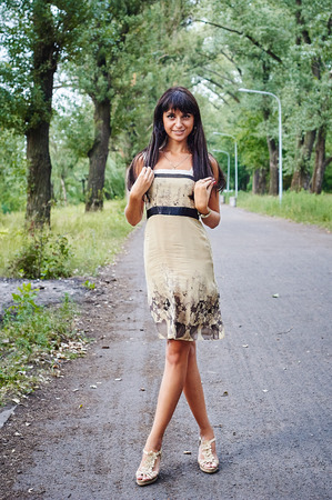 Portrait of a young beautiful woman smiling in the parkの写真素材