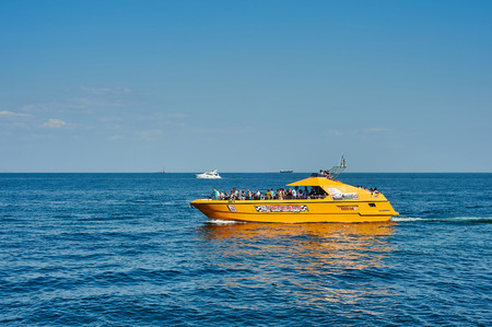 ODESSA, UKRAINE - August 31, 2015: Tourists sunbathe, swim and relax on beach having fun.  Hot summer. Odessa, Ukraineのeditorial素材