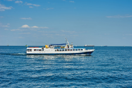 ODESSA UKRAINE - Agust, 31, 2015: White motor yacht over blue sea background. Odessa, Ukraineのeditorial素材