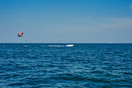 Odessa, Ukraine - August 31, 2015: Parachute on the high seas pulls motor yacht on the sea. Parachute on the high. Parachuteのeditorial素材