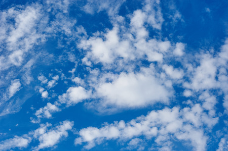 Blue sky background with tiny cloudsの写真素材