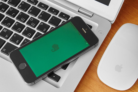 KRIVOY ROG, UKRAINE - december 12, 2015: iPhone 5s with mobile application for Evernote on the...