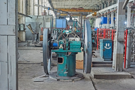 Steel sheet is wound on a roll on a special machineの写真素材