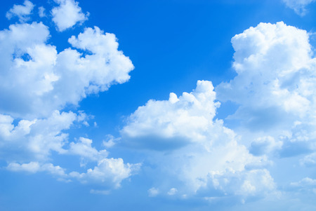 Beautifull soft white clouds against blue sky. Place for textの写真素材