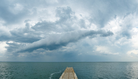 Dark rainy clouds over the Black Sea. Stormy weather. Panoramic viewの写真素材