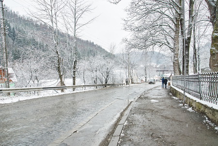 Winter rural road. Country road among frosted treesの写真素材