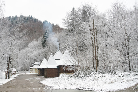 Traditional countryside house in winter. Winter rural road. Winter landscape. Ukraine, Yaremcheの写真素材