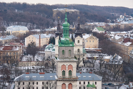 Winter view on the downtown in Lviv, Ukraine. Old buildings. Roofs covered by snowのeditorial素材
