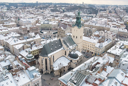 Winter view on the downtown in Lviv, Ukraine. Old buildings. Roofs covered by snowの写真素材