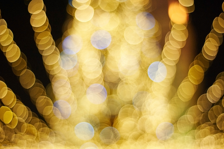 Abstract yellow bokeh background. Defocused photo.の写真素材