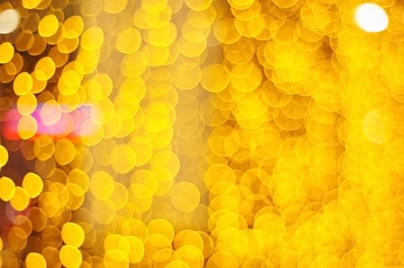 Abstract orange bokeh background. Defocused photo.の写真素材