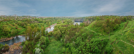 Panoramic view over a landscape of river and forest. HDR effectの写真素材
