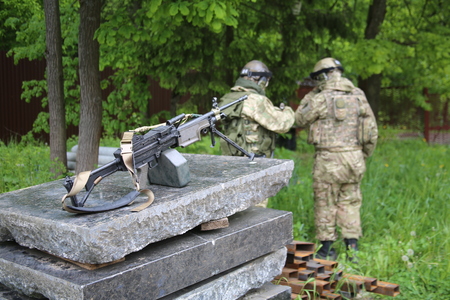 Two soldiers with a machine gun