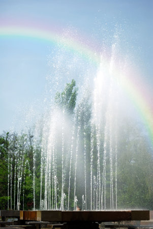 rainbow under fountainの写真素材