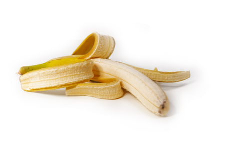 Peeled banana on white isolated backgroundの写真素材