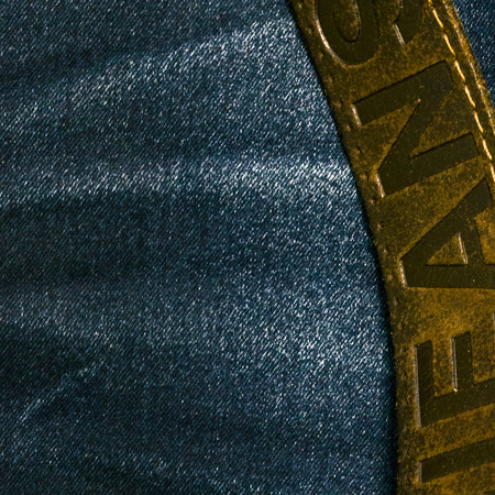 Background of jeans texture with leather beltの写真素材
