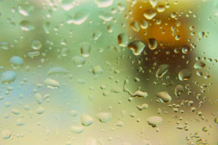 Big raindrops on the glass behind which is a blurred background. Macro shootingの写真素材