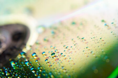 Abstract background of a compact disk and water dropsの写真素材