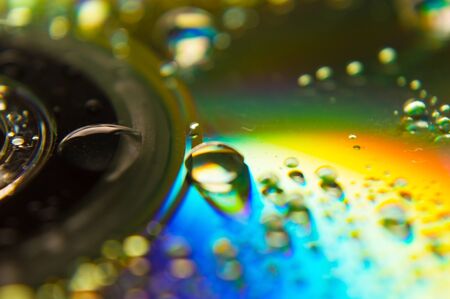 Water drops on a CD made by macro photographyの写真素材