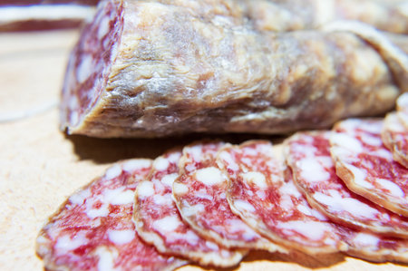 Sliced dry salami macro filming