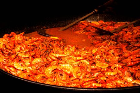 Cooking shrimp on the grill with sauceの写真素材
