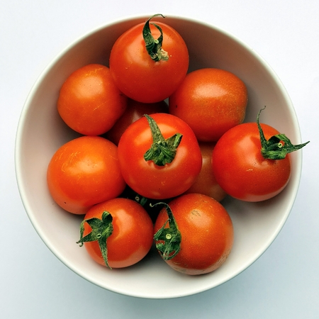 Small bowl of cherry tomatoesの写真素材