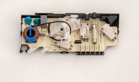 Microwave door switch circuit board isolated on a white background