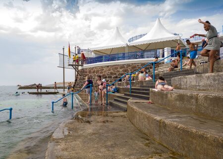 St Helier, Jersey, United Kingdom, - 07, 25, 2019: holidaymakers enjoying facilities at the sea Lidoのeditorial素材