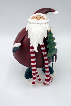 Front view of a nodding Santa Christmas bauble isolated against a white backgroundの写真素材