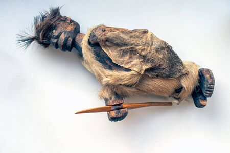 Front view of a Nigerian carved figurine isolated on a white backgroundの写真素材