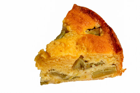 One piece of rhubarb and custard sponge isolated on a white background