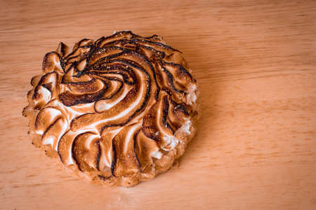 Top down view of one individual tart of lemon meringue pieの写真素材