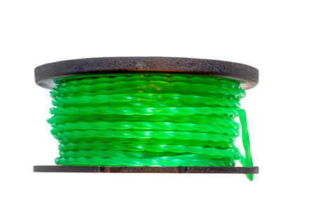 Side view of a spool and strimmer line on a white background