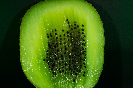 Kiwi fruit with cut peel and seeds. close-upの写真素材