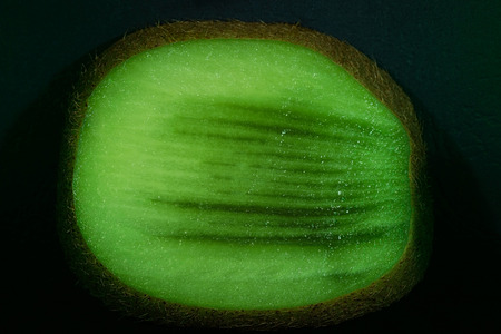 Kiwi fruit with cut peel. close-upの写真素材