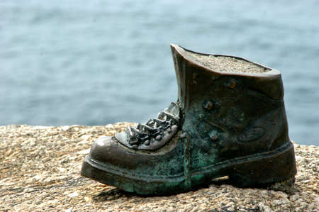 Pilgrim boot sculpture in Cape Finisterre, Spainのeditorial素材