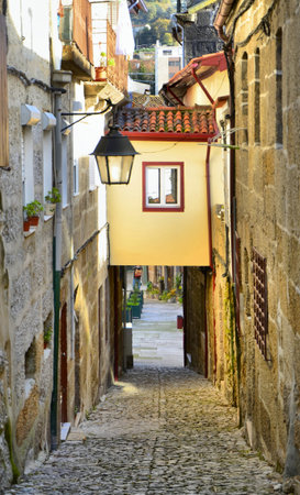 Old street in the heart of the tradition of tanning and beating hides in Guimaraes, Portugal