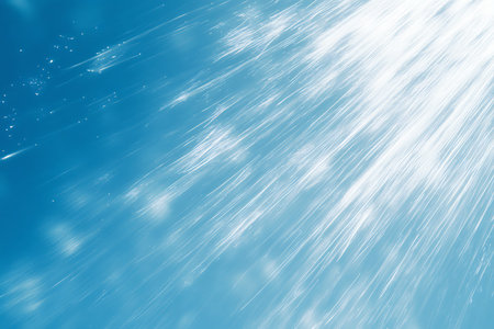 This abstract image features a dynamic blend of blues and whites, with subtle diagonal lines suggesting movement or light filtering through. Perfect for backgrounds or creative designs.の素材