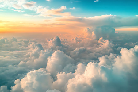 Experience the breathtaking beauty of a sky filled with soft, ethereal clouds bathed in the warm hues of sunrise or sunset. A moment of tranquil beauty.の素材