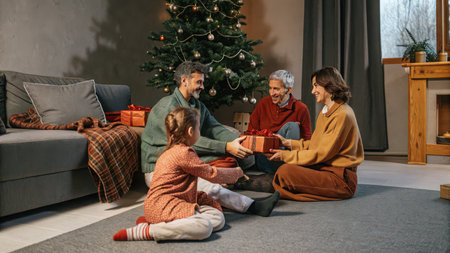 A heartwarming scene of a family joyfully exchanging gifts around a decorated Christmas tree, creating cherished memories during the festive holiday season indoors.の素材
