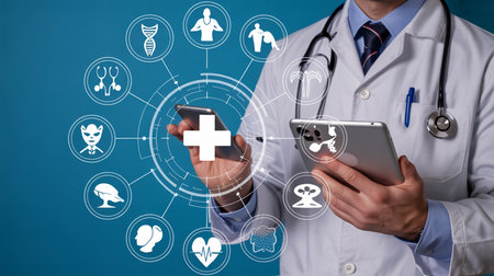 Doctor holding smartphone and tablet with medical icons on blue backgroundの素材