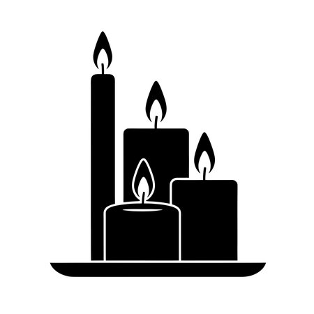 Silhouette of burning candles on plate - tranquil decor and warmthのイラスト素材