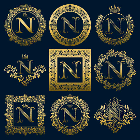 Vintage monograms set of N letter. Golden heraldic  in wreaths, round and square frames.のイラスト素材