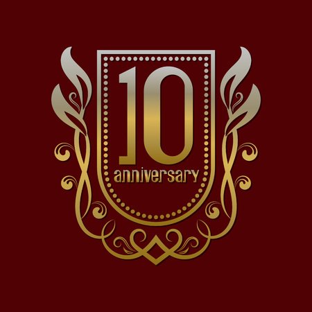 Tenth anniversary vintage logo symbol. Golden emblem with numbers on shield in wreath.のイラスト素材