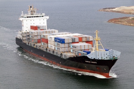 VARNA, BULGARIA - DECEMBER 14: Cargo ship WARNOW VAQUITA (Year Built: 2008) sails into open sea on December 14, 2010 in Varna, Bulgaria. Ship`s next destination is Constanta, Romania.のeditorial素材