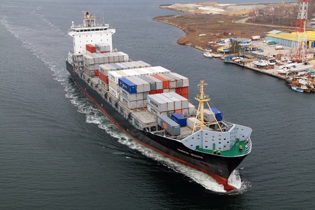 VARNA, BULGARIA - DECEMBER 14: Cargo ship WARNOW VAQUITA (Year Built: 2008) sails into open sea on December 14, 2010 in Varna, Bulgaria. Ship`s next destination is Constanta, Romania.のeditorial素材