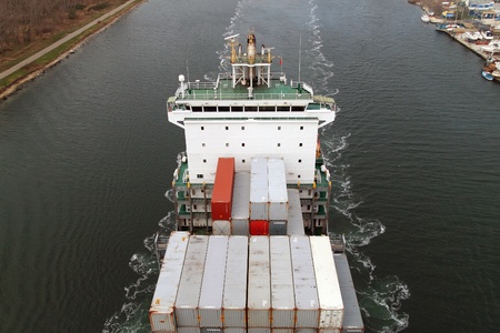 VARNA, BULGARIA - DECEMBER 14: Cargo ship WARNOW VAQUITA (Year Built: 2008) sails into open sea on December 14, 2010 in Varna, Bulgaria. Ship`s next destination is Constanta, Romania.のeditorial素材