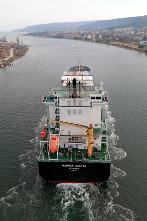 VARNA, BULGARIA - DECEMBER 14: Cargo ship WARNOW VAQUITA (Year Built: 2008) sails into open sea on December 14, 2010 in Varna, Bulgaria. Ship`s next destination is Constanta, Romania.のeditorial素材